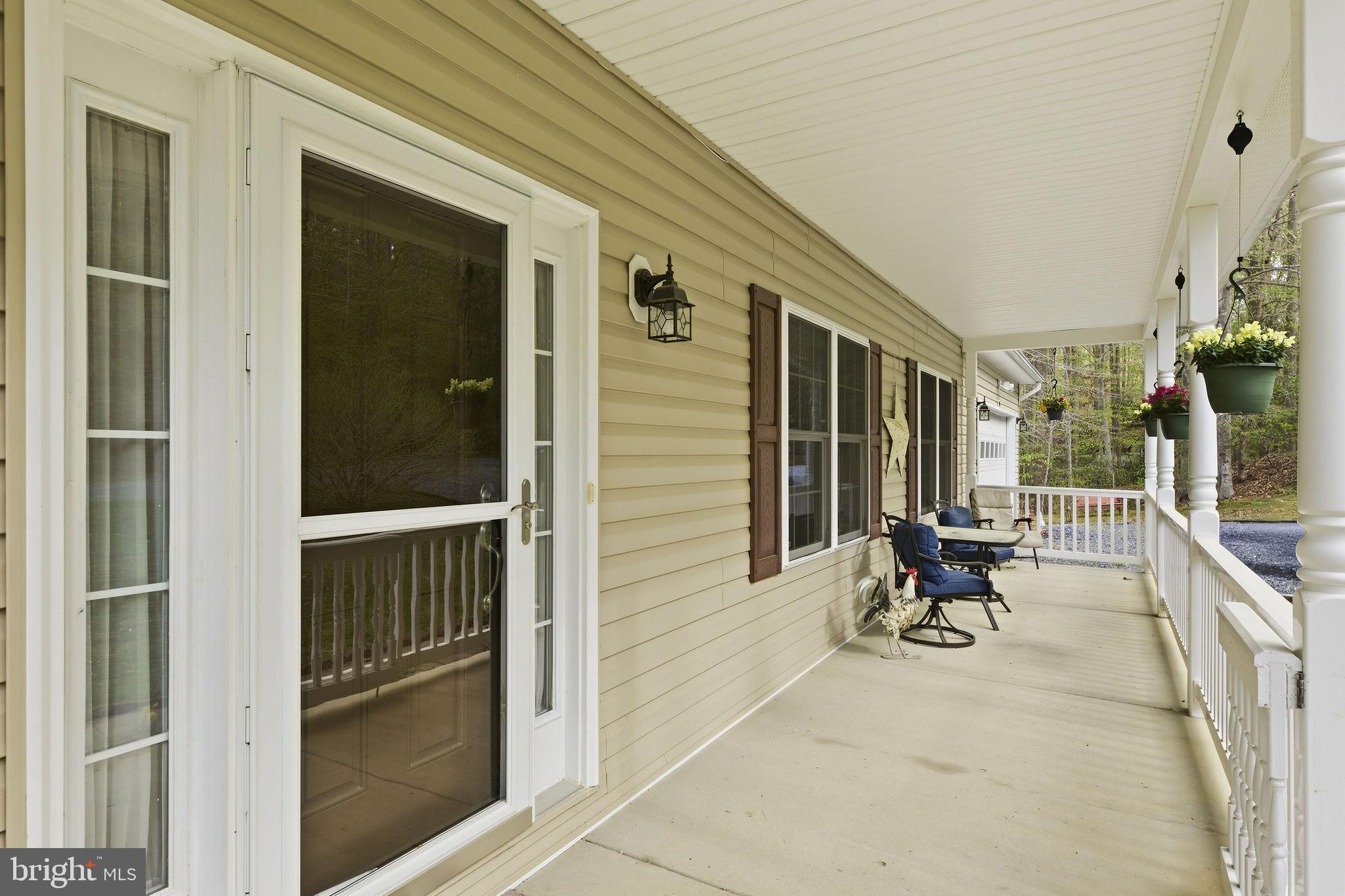 405 Ball Road St. Leonard, MD 20685 - Photo 4 of 40 a view of a entryway door of the house
