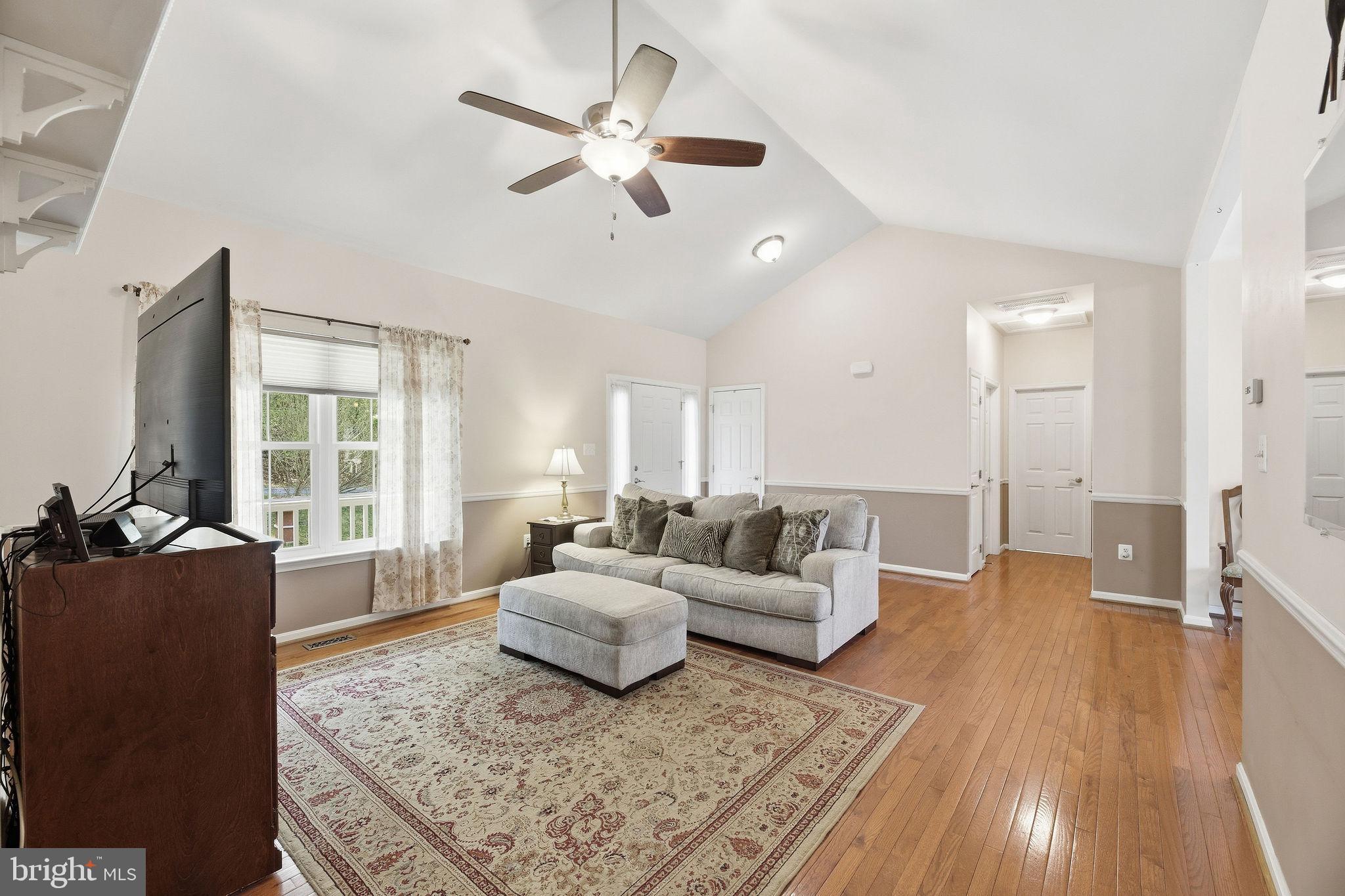 405 Ball Road St. Leonard, MD 20685 - Photo 8 of 40 a living room with furniture and a large window