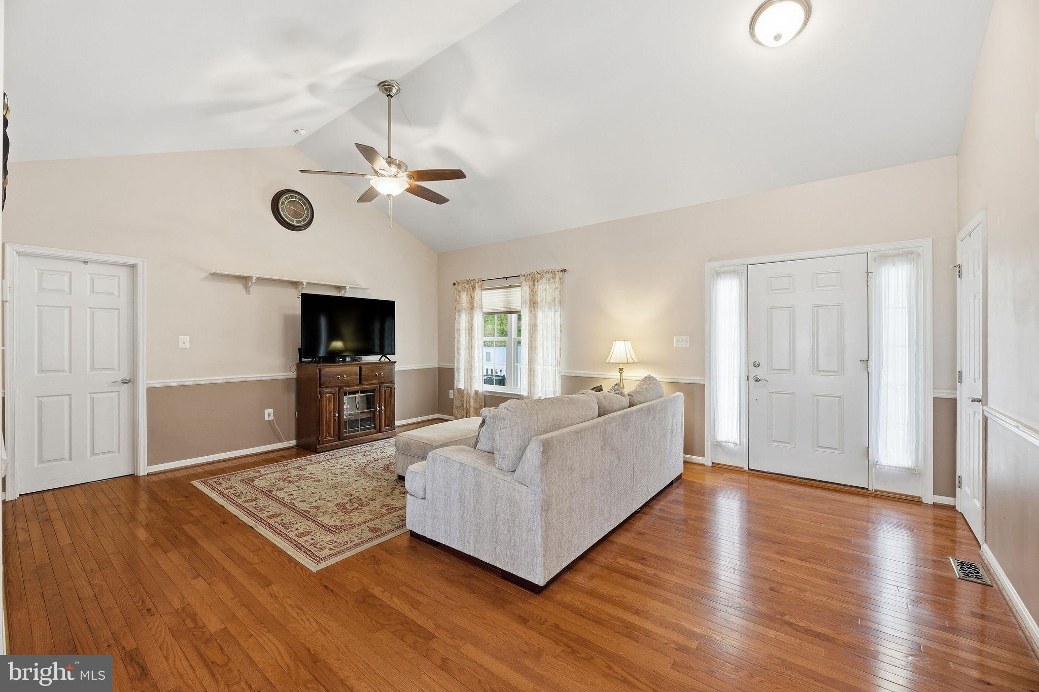 405 Ball Road St. Leonard, MD 20685 - Photo 10 of 40 a living room with furniture and a flat screen tv
