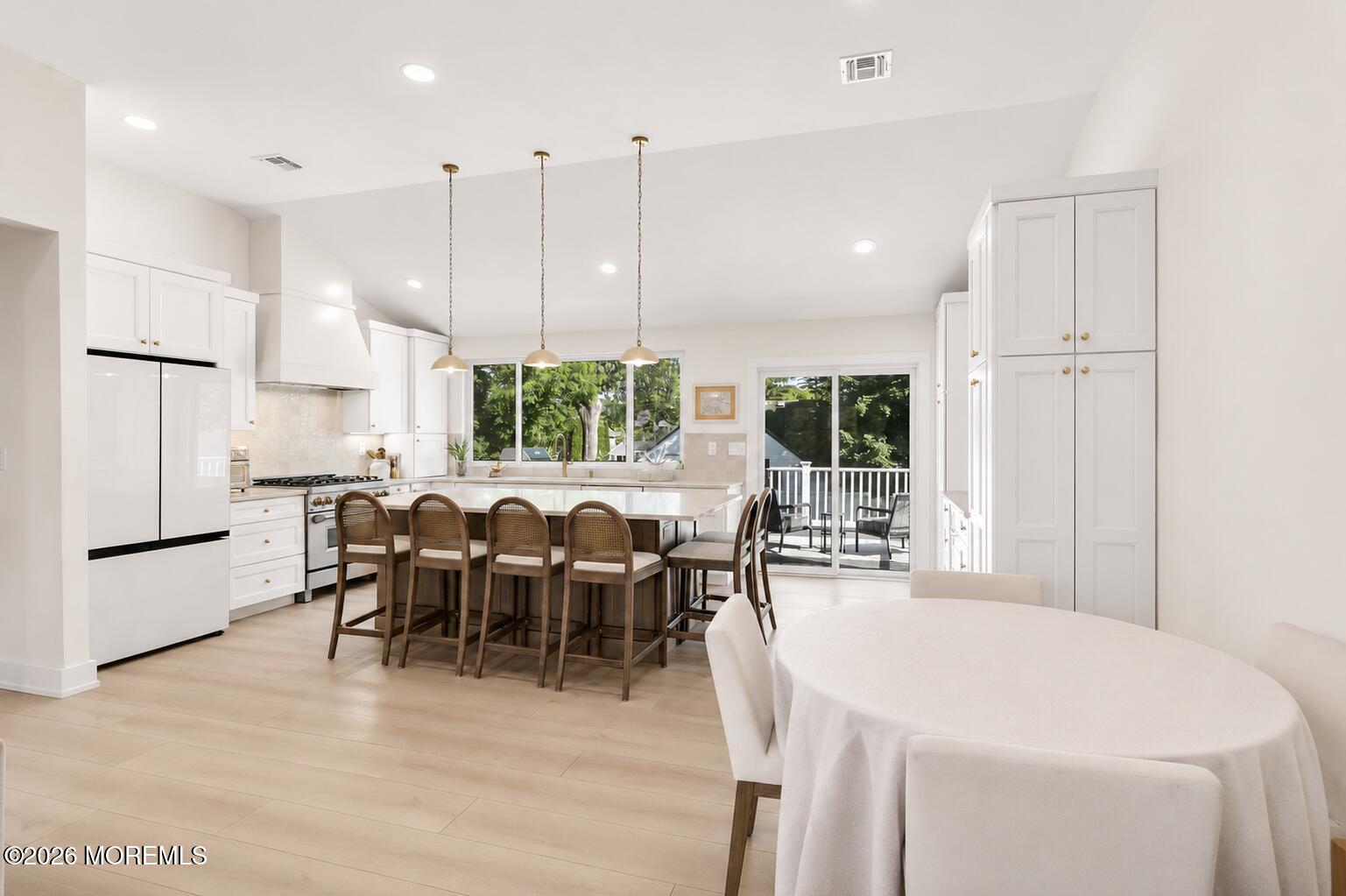 53 Field Avenue Red Bank, NJ 07701 - Photo 9 of 39 a large kitchen with a table and chairs