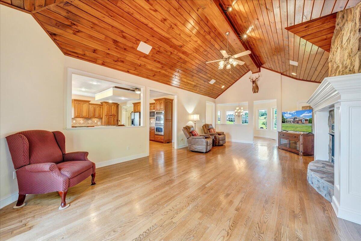 625 Frontier Way Fincastle, VA 24090 - Photo 16 of 105 a living room with furniture and a wooden floor