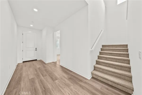 a view of entryway with wooden floor