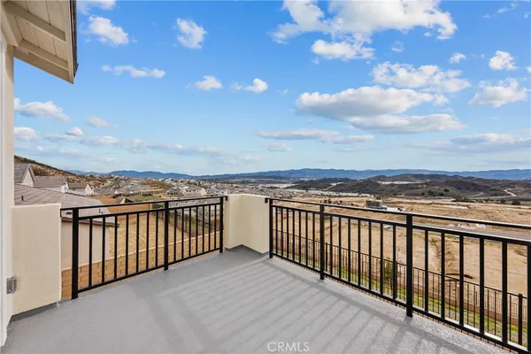 a view of a balcony with city
