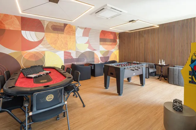 a living room filled with furniture and wooden floor
