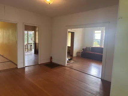 a bathroom with a sink a toilet and a window