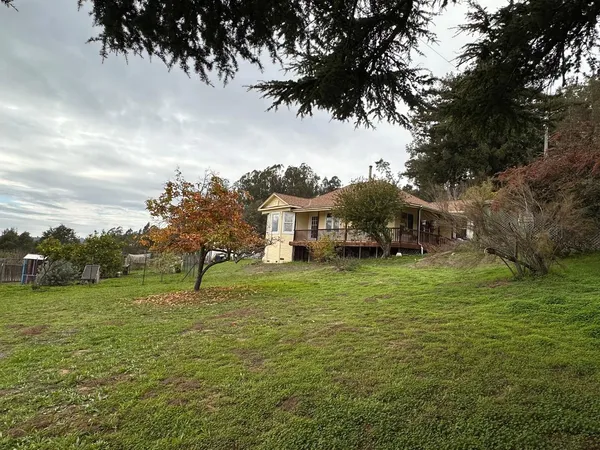 a view of a car park in front of house
