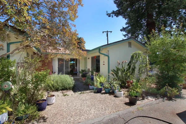 a view of a house with a tree