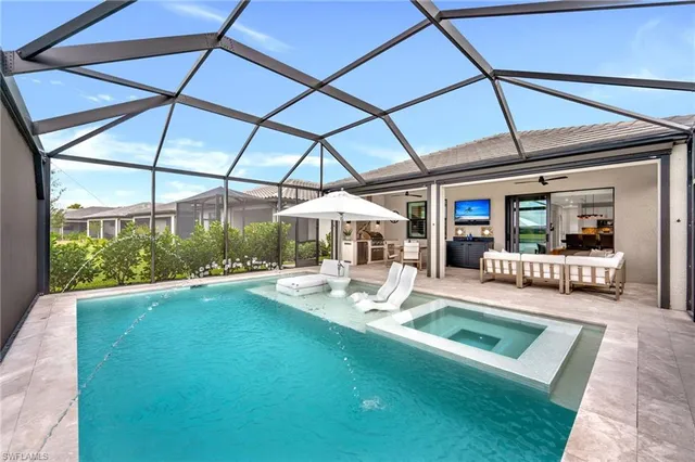 a view of a backyard with a patio and a yard