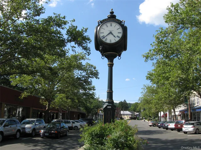 a view of a street with cars on road