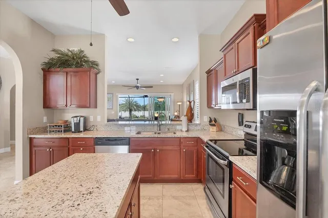 a kitchen with a sink stove and cabinets