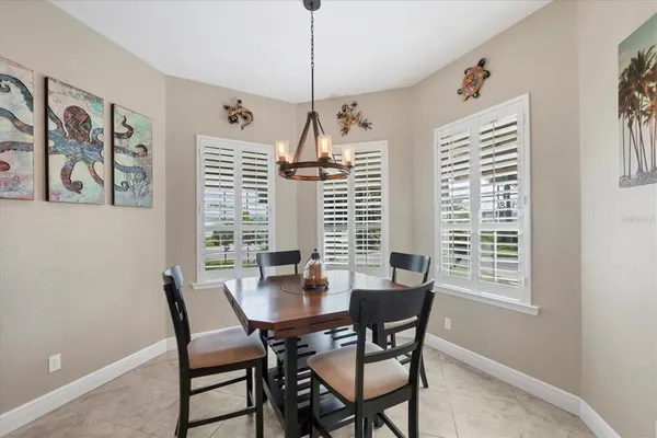 a dining room with furniture and window