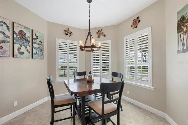 a dining room with furniture and window