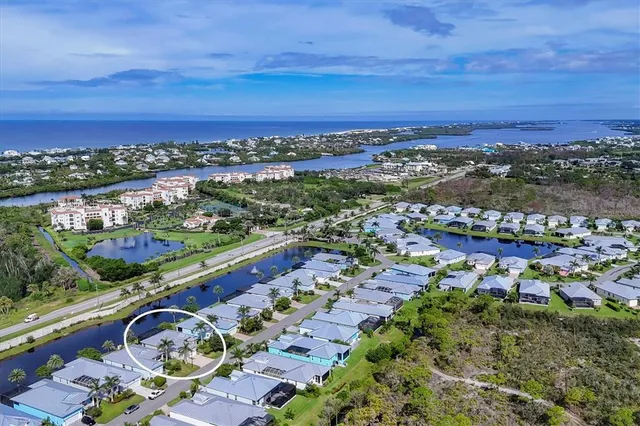 an aerial view of residential building and ocean