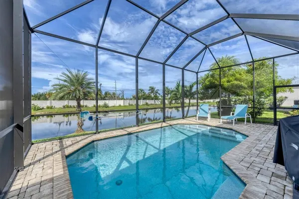a view of a swimming pool with a patio