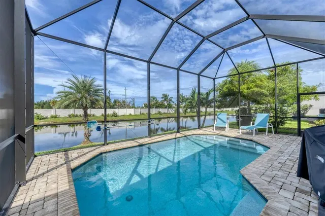 a view of a swimming pool with a patio