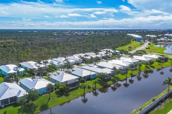 an aerial view of a house with a lake view