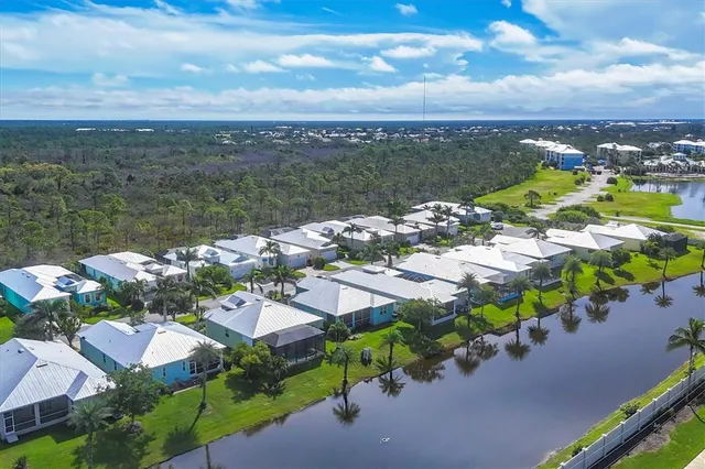 an aerial view of a house with a lake view