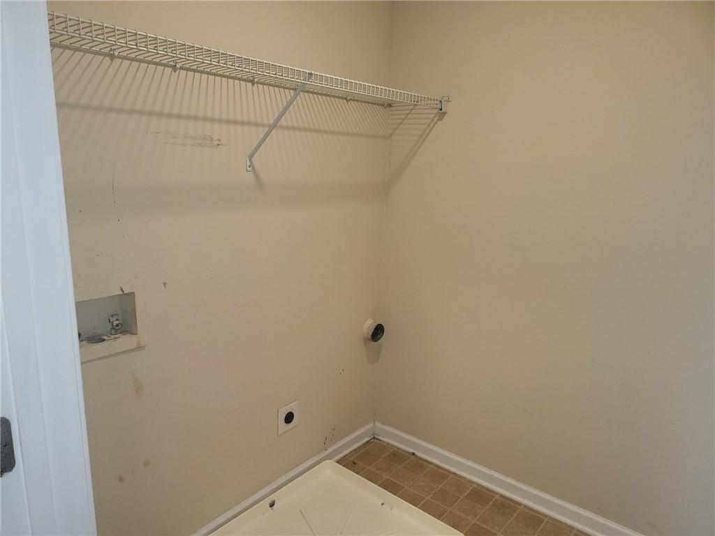 91 Meeting Pl Road Lawrenceville, GA 30044 - Photo 16 of 18 a view of a room with racks on the wall