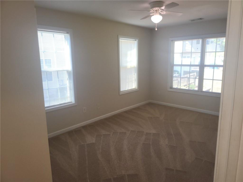 91 Meeting Pl Road Lawrenceville, GA 30044 - Photo 17 of 18 a view of an empty room with a window