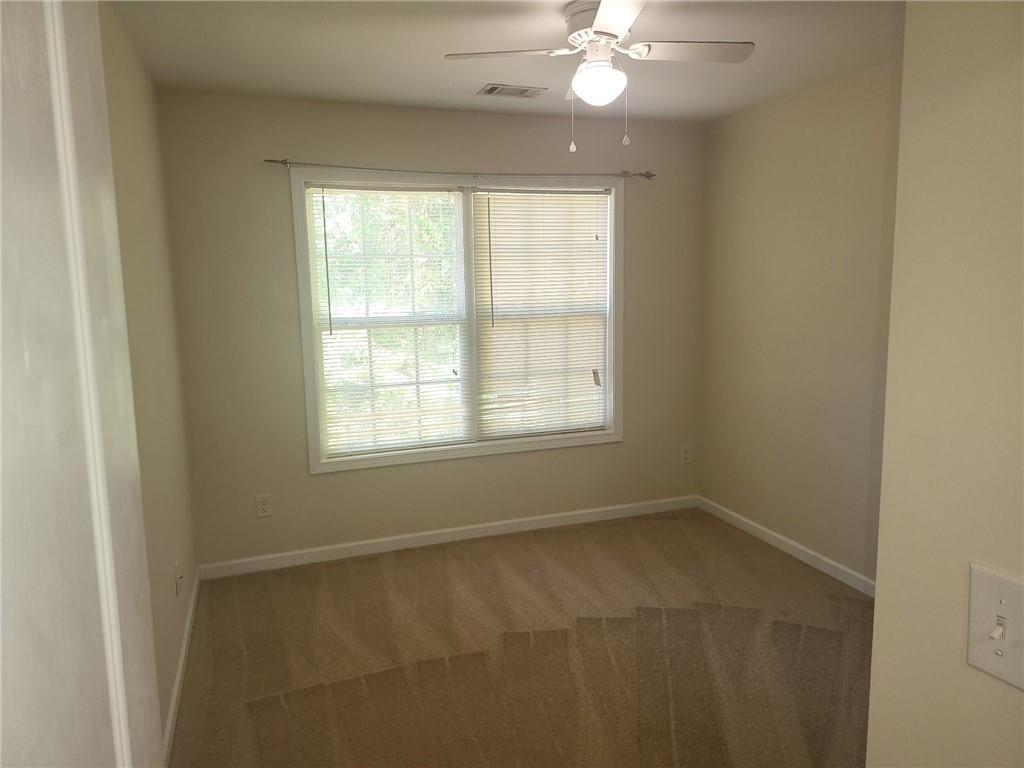 91 Meeting Pl Road Lawrenceville, GA 30044 - Photo 18 of 18 a view of an empty room with a window
