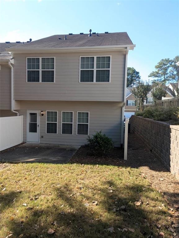 91 Meeting Pl Road Lawrenceville, GA 30044 - Photo 3 of 18 a view of a house with a yard