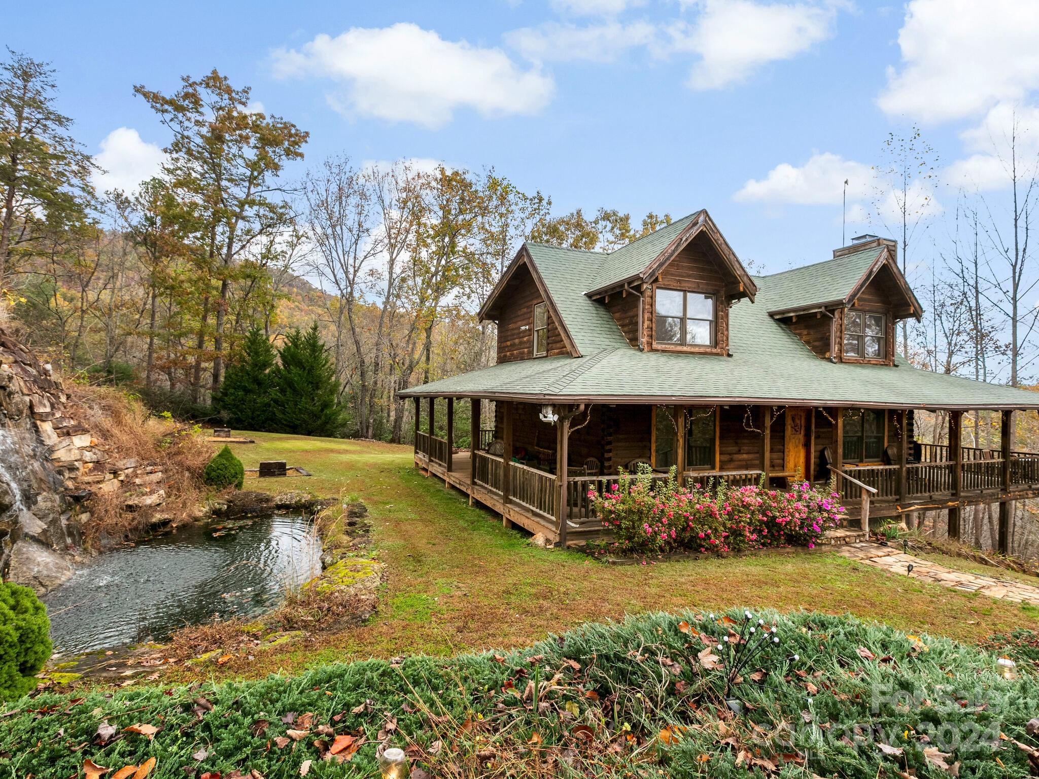 354 Nelons Road Mill Spring, NC 28756 - Photo 1 of 32 an aerial view of a house with swimming pool garden and patio