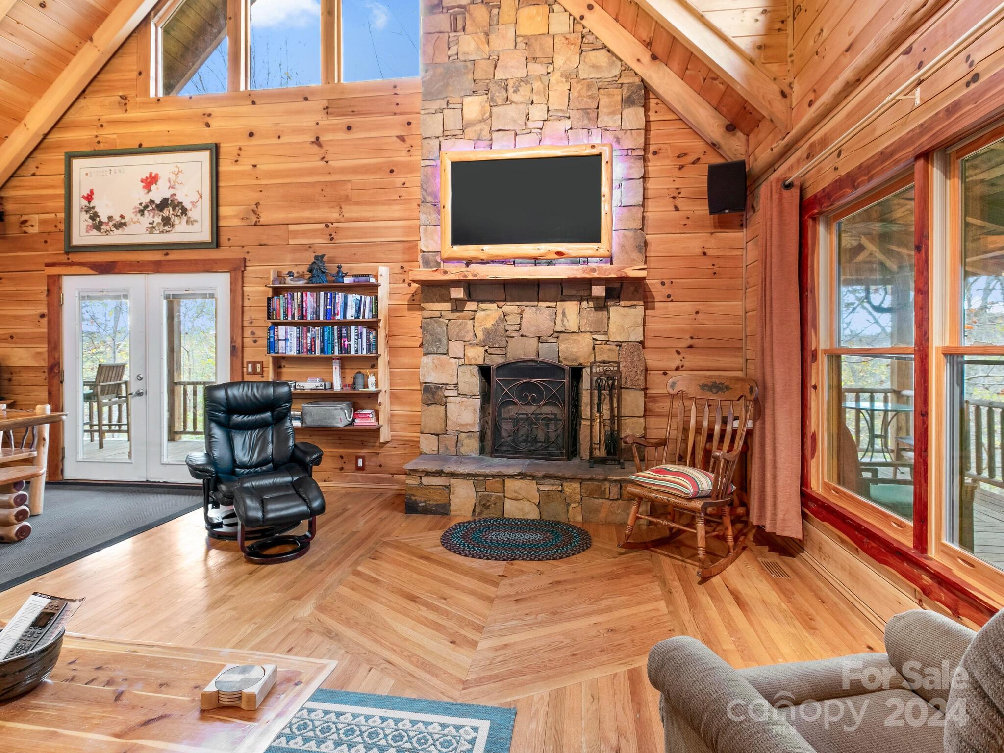 354 Nelons Road Mill Spring, NC 28756 - Photo 11 of 32 a living room with furniture a fireplace and a flat screen tv
