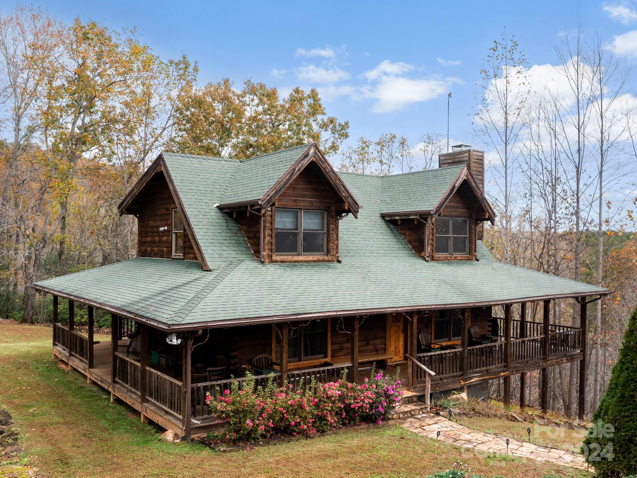354 Nelons Road Mill Spring, NC 28756 - Photo 2 of 32 a aerial view of a house with sitting area