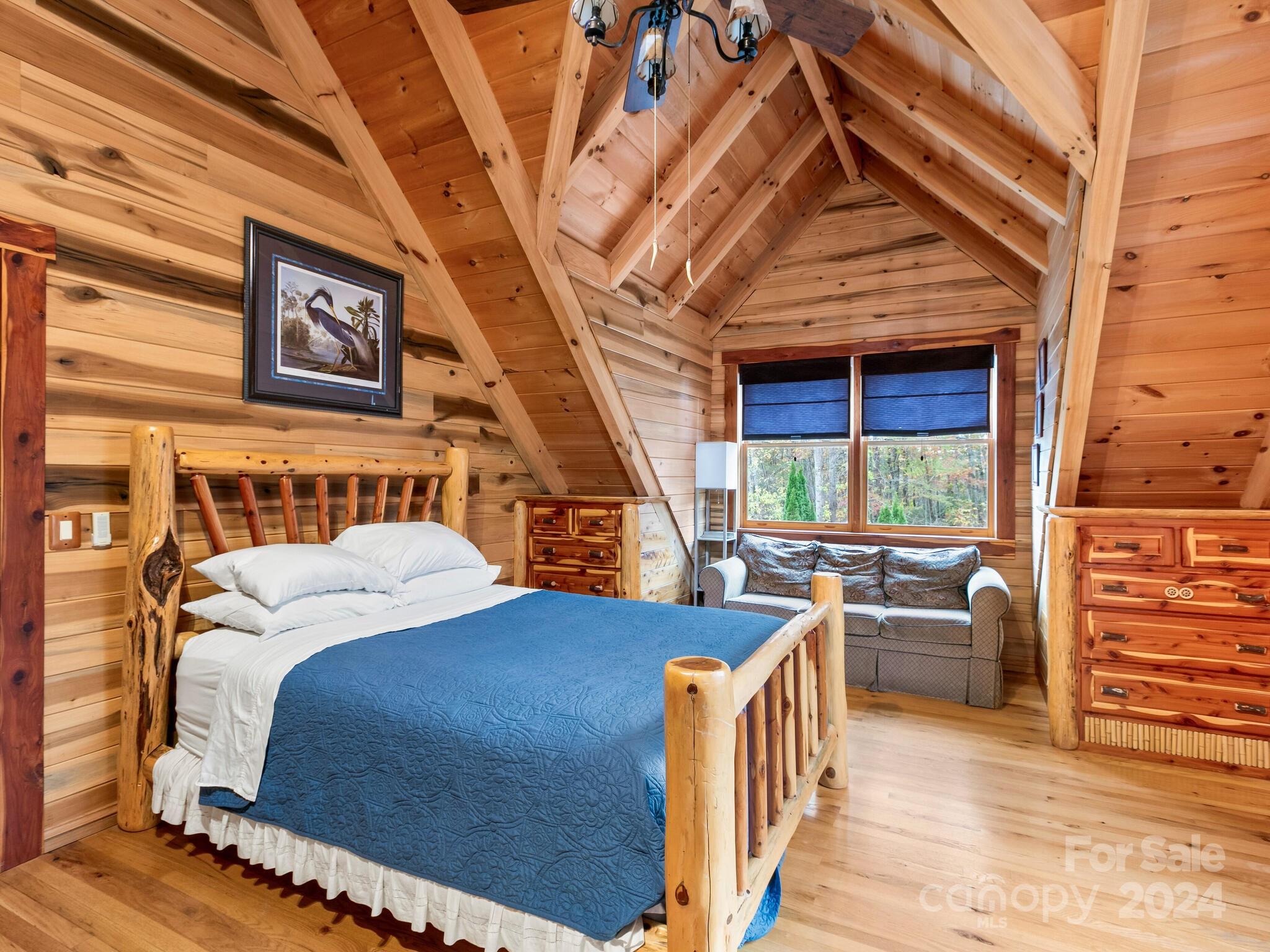 354 Nelons Road Mill Spring, NC 28756 - Photo 23 of 32 a bedroom with furniture and a large window