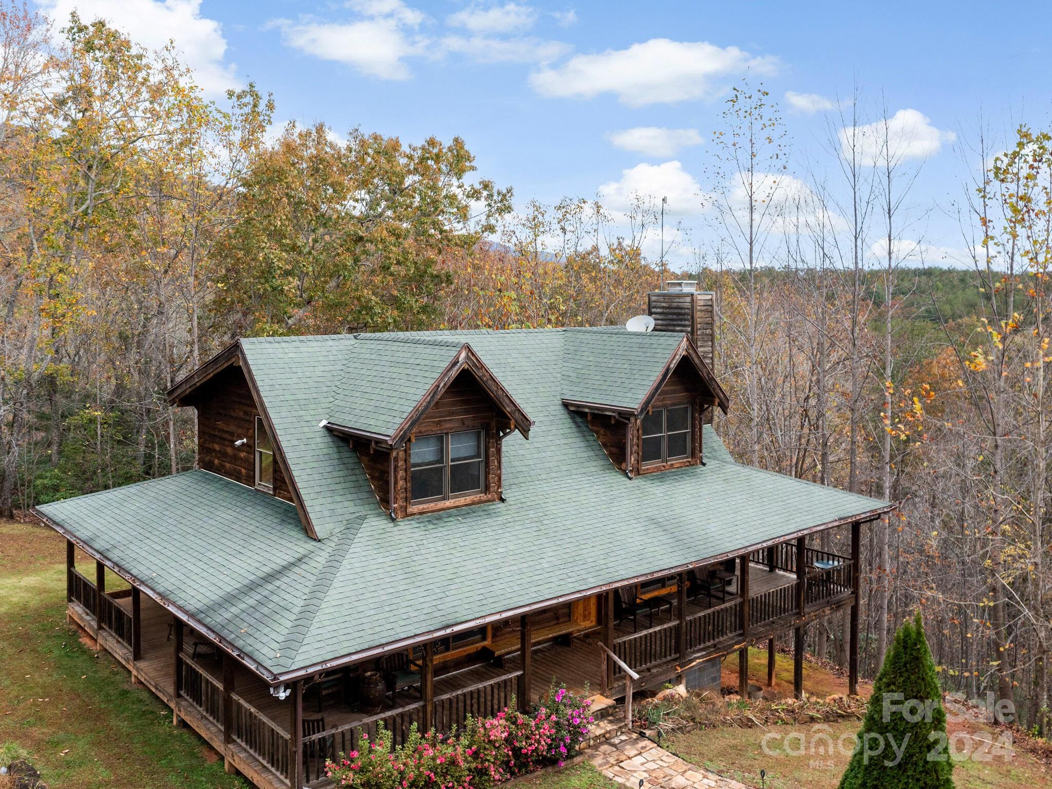354 Nelons Road Mill Spring, NC 28756 - Photo 29 of 32 a view of a roof deck with wooden floor and fence