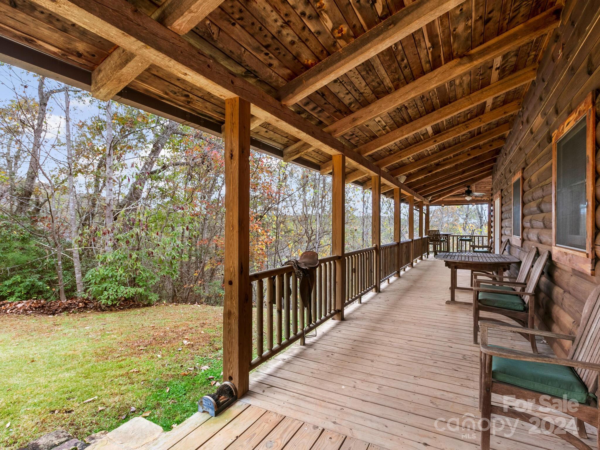 354 Nelons Road Mill Spring, NC 28756 - Photo 30 of 32 a view of a porch with furniture and garden