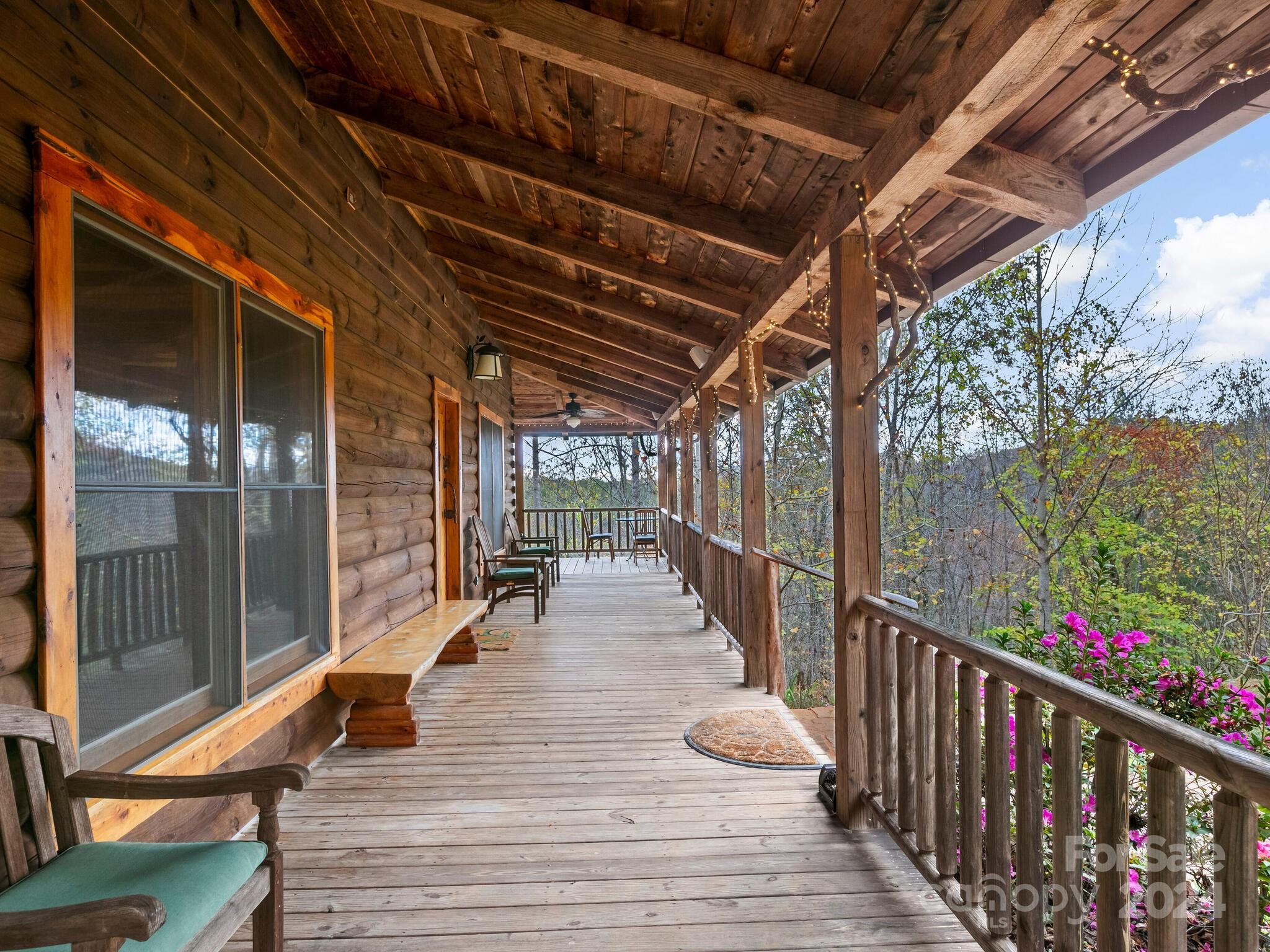 354 Nelons Road Mill Spring, NC 28756 - Photo 4 of 32 a view of a balcony with wooden floor