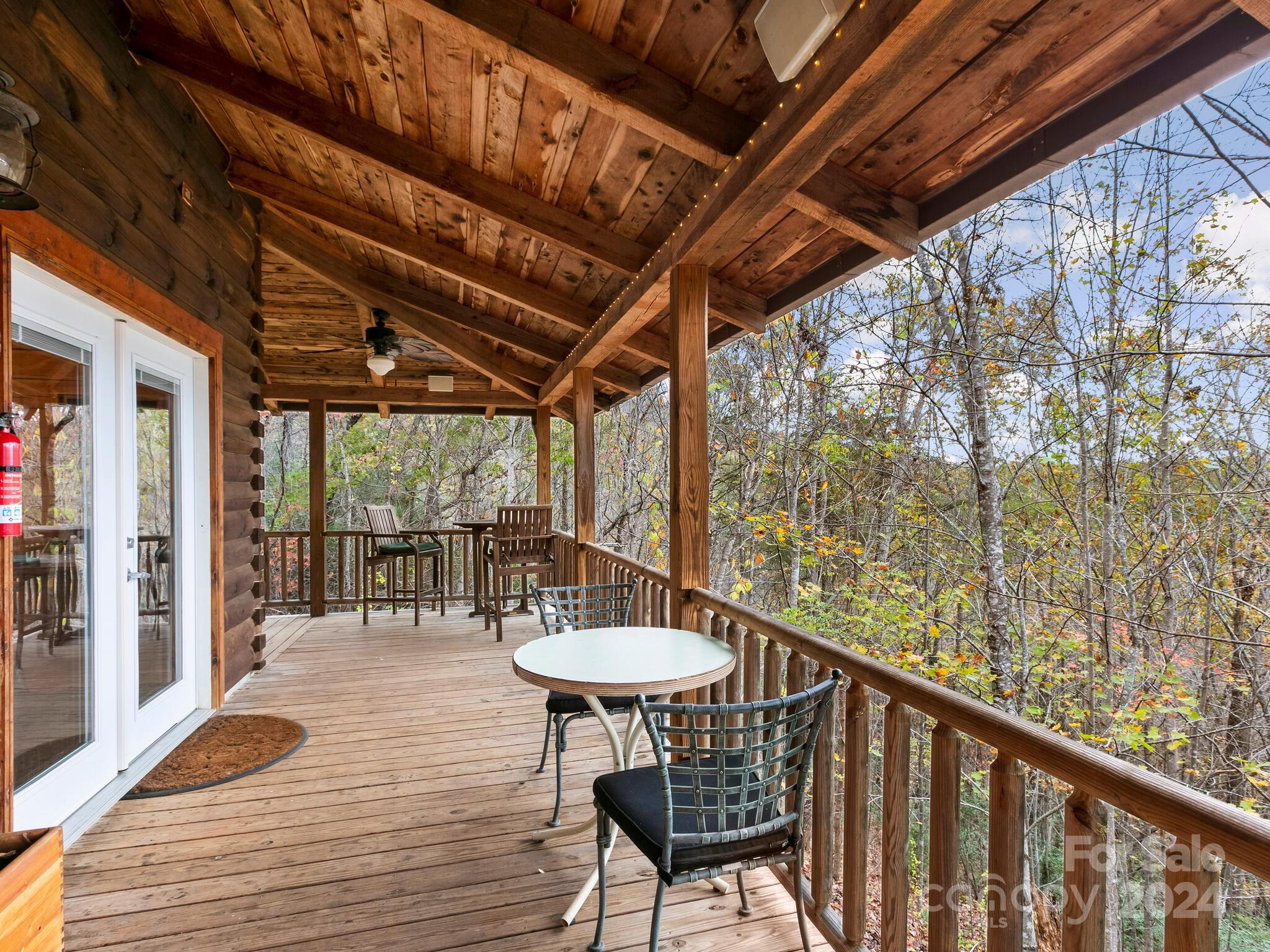 354 Nelons Road Mill Spring, NC 28756 - Photo 5 of 32 a view of a chairs and table in the balcony