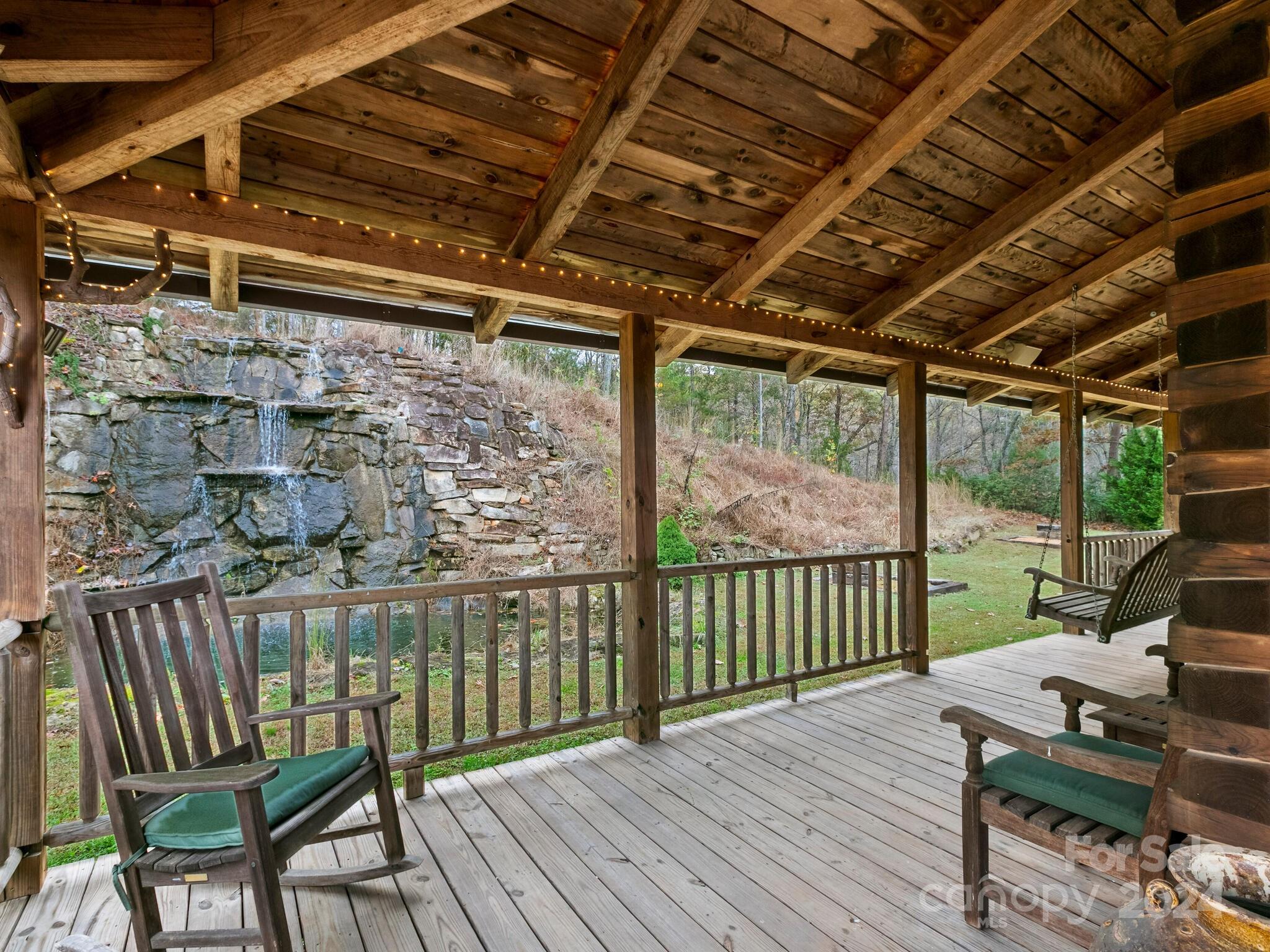 354 Nelons Road Mill Spring, NC 28756 - Photo 6 of 32 a view of a balcony with wooden floor