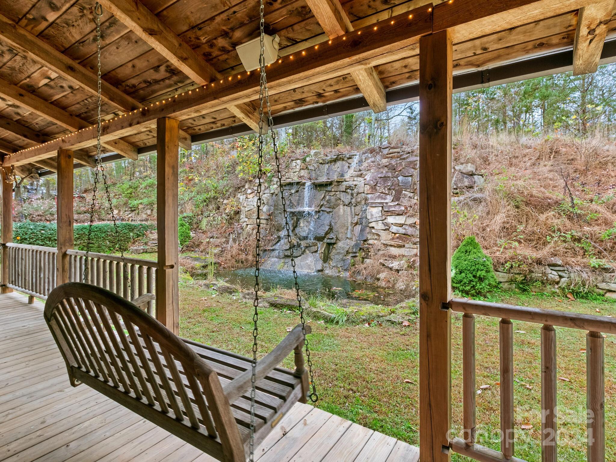 354 Nelons Road Mill Spring, NC 28756 - Photo 7 of 32 a view of a balcony with wooden floor