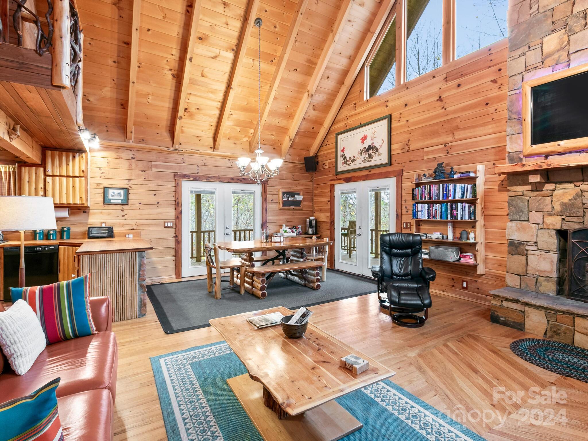 354 Nelons Road Mill Spring, NC 28756 - Photo 10 of 32 a living room with fireplace furniture and a flat screen tv
