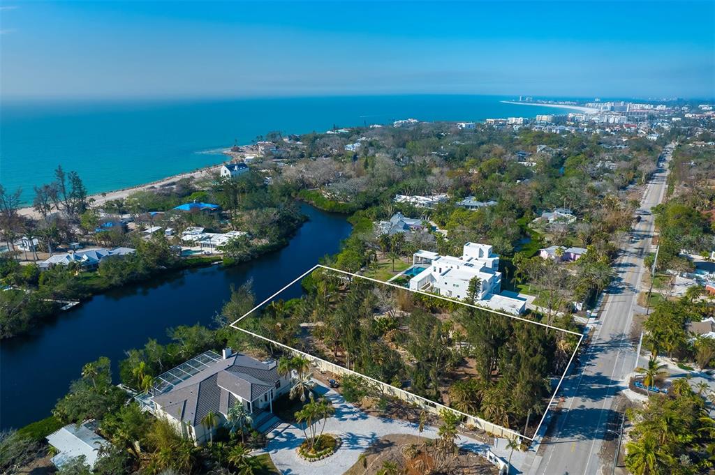 an aerial view of a houses with a yard