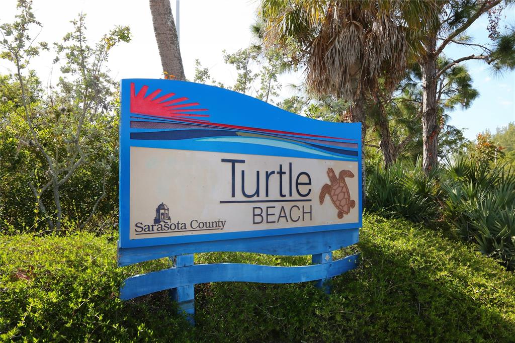 7510 Midnight Pass Road Sarasota, FL 34242 - Photo 13 of 25 a sign that is on a pole