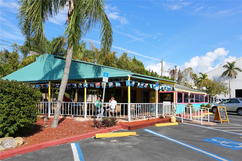 7510 Midnight Pass Road Sarasota, FL 34242 - Photo 17 of 25 a view of a building with a garden