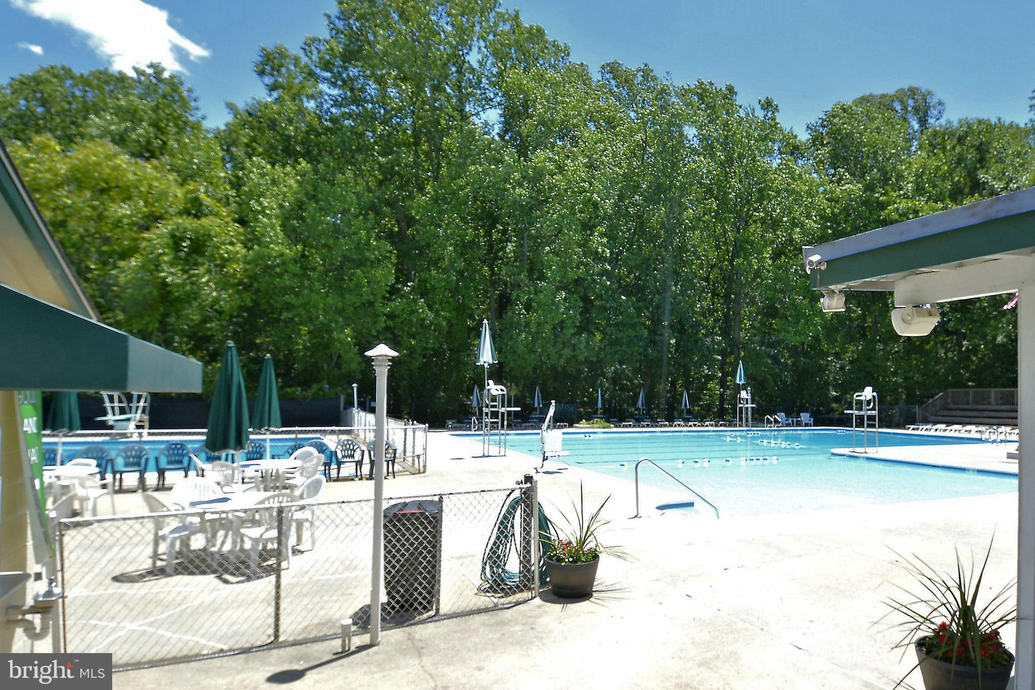 1049 Windrush Lane, Unit 2 Sandy Spring, MD 20860 - Photo 54 of 59 a view of a swimming pool with a patio