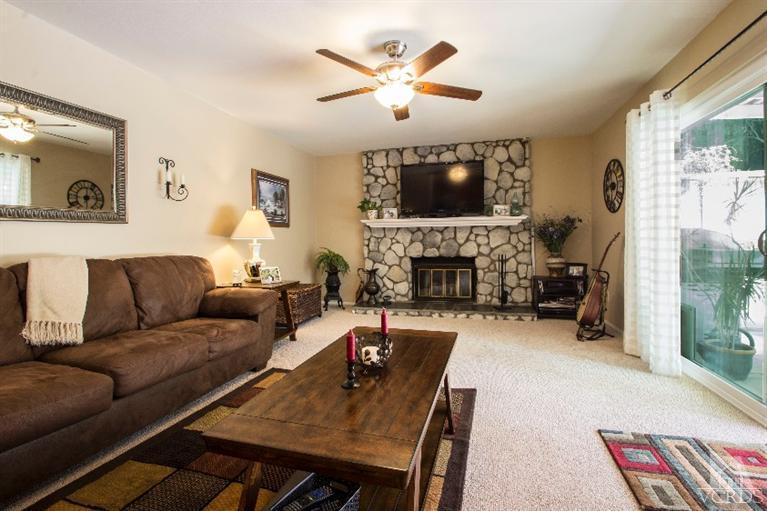 520 Fresh Meadows Road Simi Valley, CA 93065 - Photo 25 of 26 a living room with furniture a fireplace and a flat screen tv