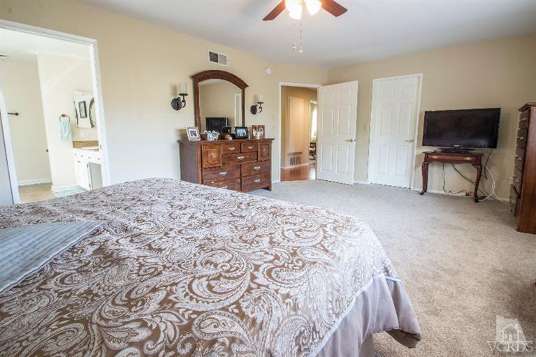 520 Fresh Meadows Road Simi Valley, CA 93065 - Photo 6 of 26 a bedroom with a bed and a television in it