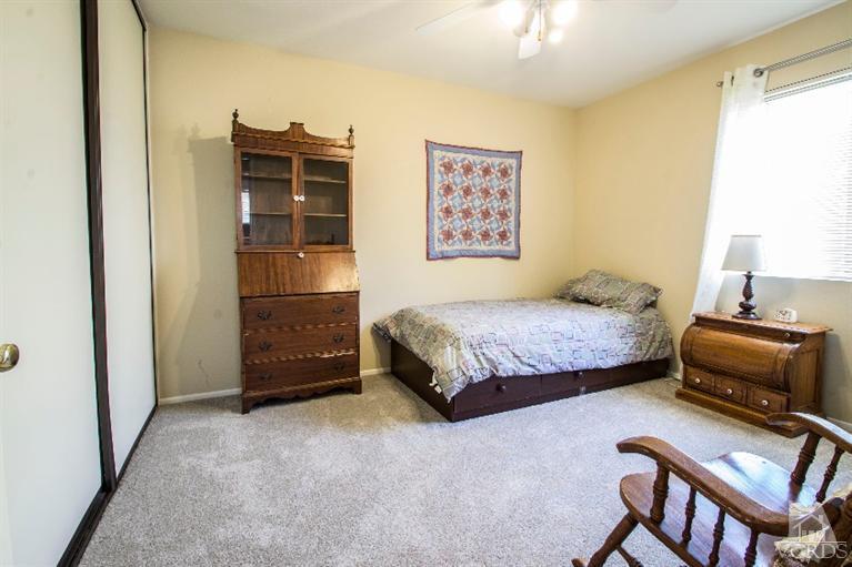 520 Fresh Meadows Road Simi Valley, CA 93065 - Photo 9 of 26 a bedroom with a bed and a couch