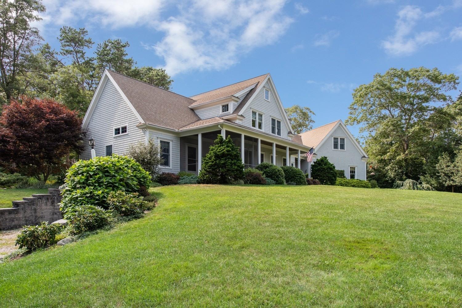 a front view of house with yard and green space