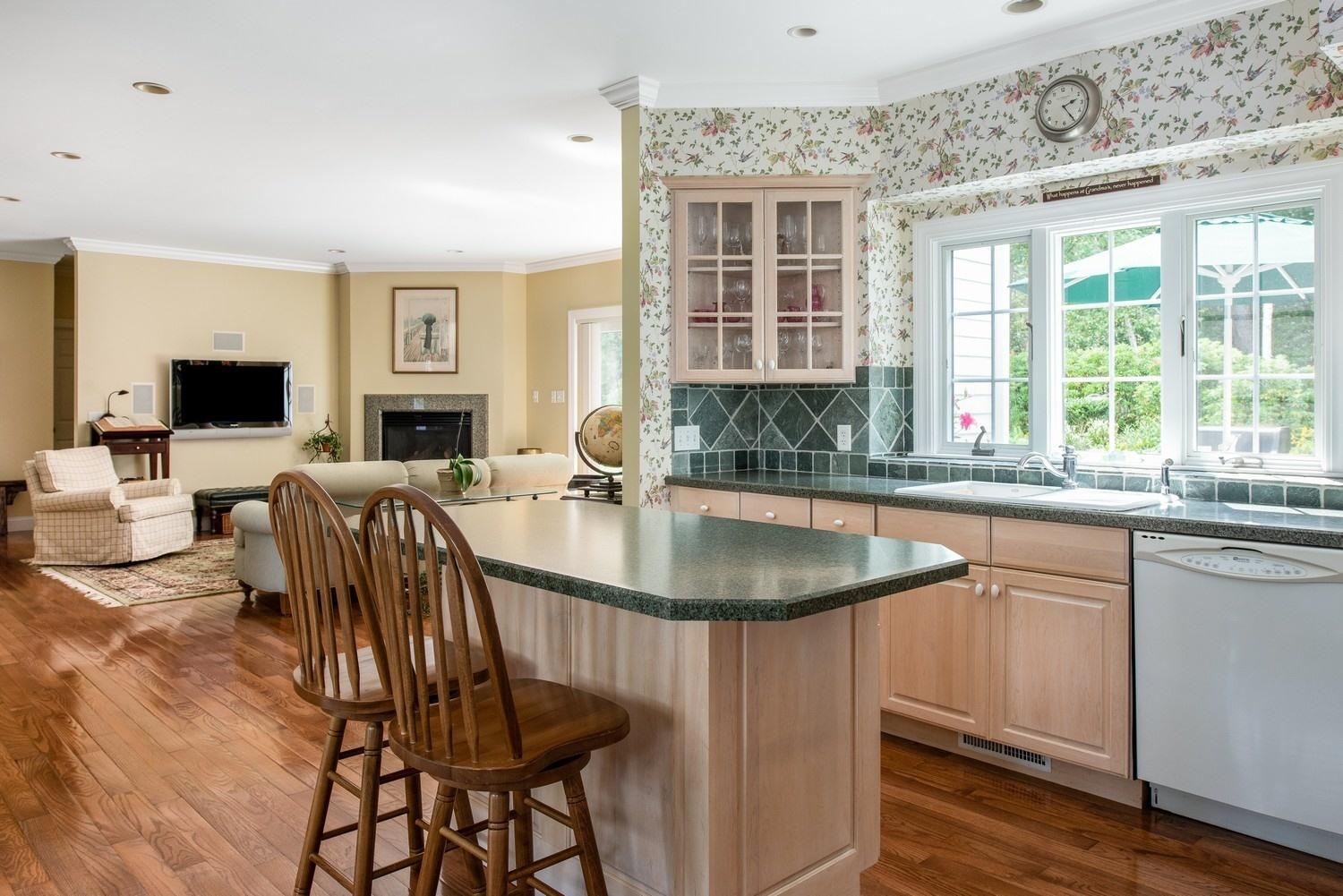 455 Turtleback Road Marstons Mills, MA 02648 - Photo 18 of 29 a kitchen with a stove a sink and a refrigerator