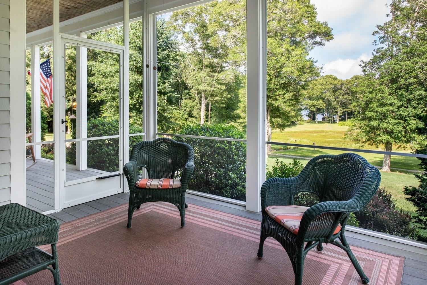 455 Turtleback Road Marstons Mills, MA 02648 - Photo 4 of 29 a sitting chair in the balcony next to a yard