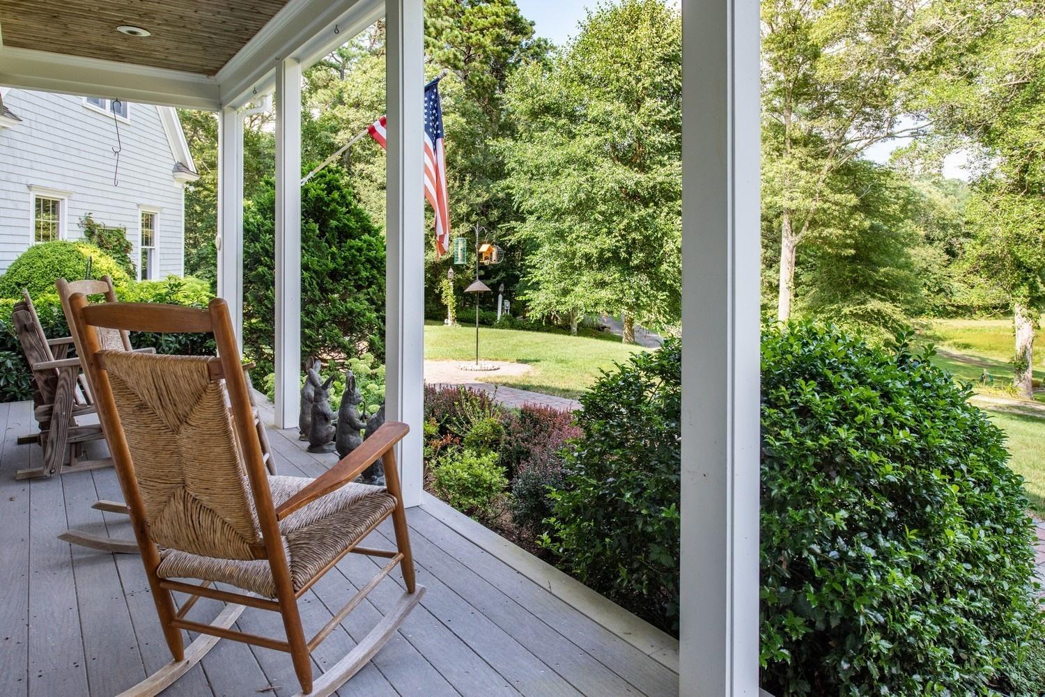 455 Turtleback Road Marstons Mills, MA 02648 - Photo 5 of 29 a view of a wooden chairs in backyard of house