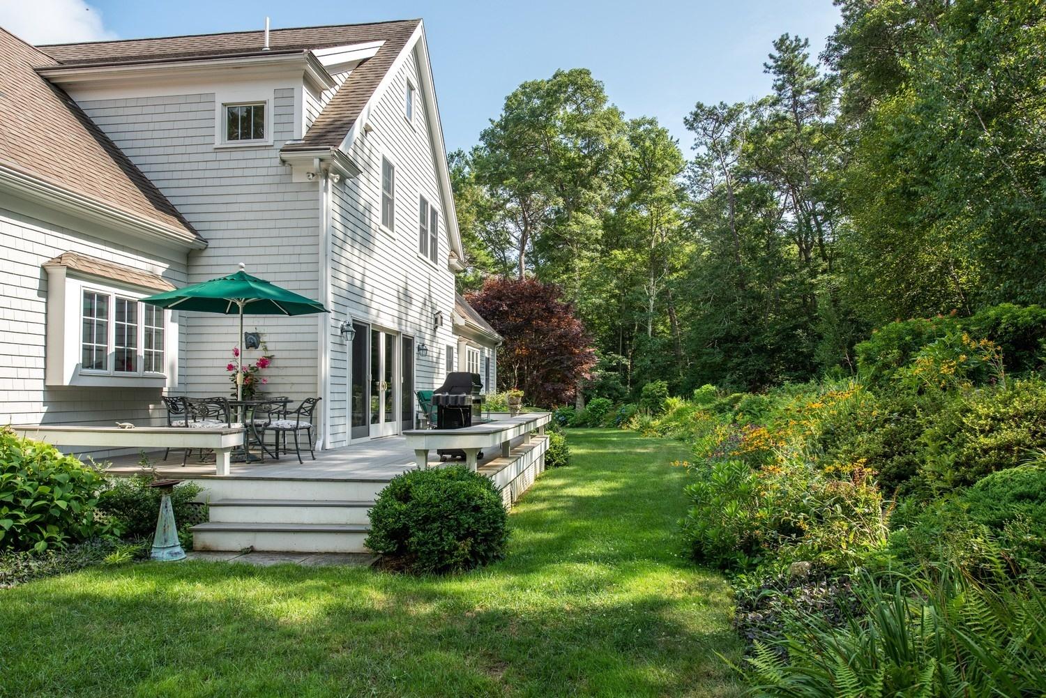 455 Turtleback Road Marstons Mills, MA 02648 - Photo 8 of 29 a view of backyard of house with green space