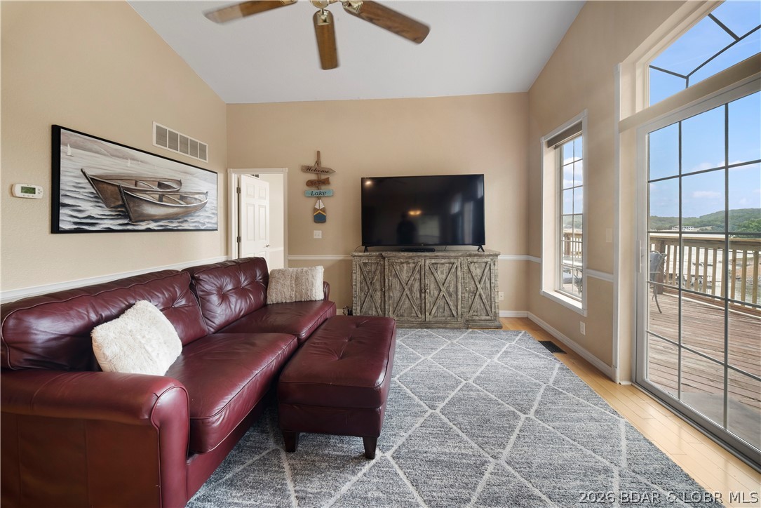 2247 Breezy Acres Road Osage Beach, MO 65065 - Photo 3 of 53 Great Room is highlighted by wall of windows and l