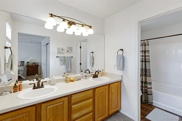 a bathroom with a double vanity sink mirror and double